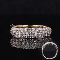 an image of a wedding band with diamonds on it and a ring in the middle