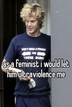 a man with blonde hair wearing a t - shirt that says as feminist i would let him