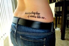 a woman with a tattoo on her stomach that says, i am not the only one of someone like me