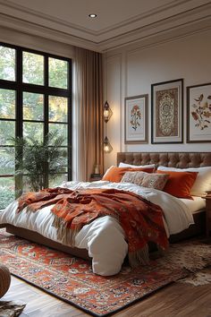 a large bed sitting next to a window in a bedroom on top of a wooden floor