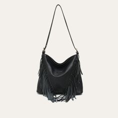 Discover Elegant Style and Functionality Embrace the perfect blend of fashion and practicality with our Luxurious Vegan Leather Tassel Shoulder Bag. Designed for the modern woman, this versatile hobo crossbody handbag is a must-have accessory for any wardrobe. Made from high-quality PU vegan leather, this bag is not only stylish but also ethically conscious. The elegant tassel decoration adds a bohemian touch, making it ideal for both casual and formal occasions. Key Features Material: High-grade PU Vegan Leather Spacious Interior: Includes a zipper pocket and a slot pocket Convenient Exterior: Features a back zipper pocket for easy access Secure Closure: Reliable zipper to keep your belongings safe Single Shoulder Strap: For comfortable carrying as a shoulder or crossbody bag Size: Genero Fall Hobo Bag With Adjustable Strap For Errands, Fall Hobo Bag With Zipper Closure For Errands, Chic Hobo Bucket Bag With Adjustable Strap, Chic Travel Hobo Bag With Fringe, Black Fringe Hobo Bag For Everyday, Chic Fringe Hobo Bag For Travel, Chic Fringe Crossbody Shoulder Bag, Chic Hobo Bag For Fall, Chic Fringe Top Handle Shoulder Bag