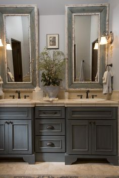 a bathroom with two sinks and mirrors on the wall next to each other in it