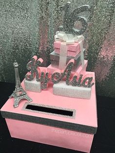 there is a pink box with silver decorations on it