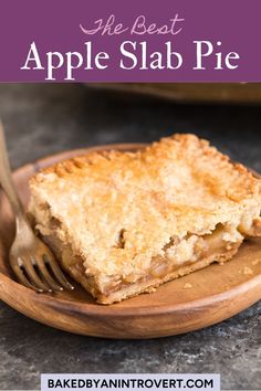 a slice of apple slab pie on a wooden plate with a fork and text overlay that reads the best apple slab pie