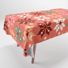 an image of a table cloth with flowers and crosses pattern on it in pink colors