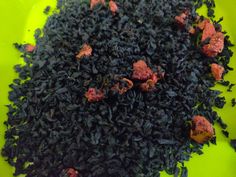 a yellow plate filled with lots of black tea