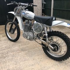 a dirt bike parked in front of a building