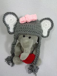 a stuffed animal wearing a crocheted hat