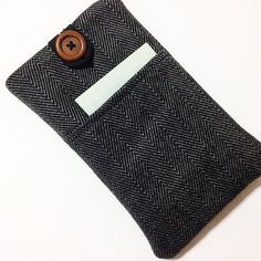 a black and white case with a button on it