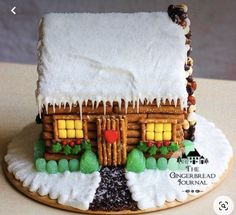 a gingerbread house made to look like a log cabin