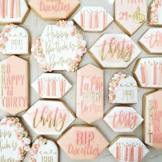 some decorated cookies with pink and gold frosting