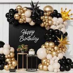 a black and gold birthday party with balloons