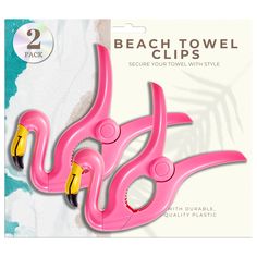 two pink beach towel clips with yellow handles