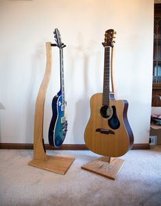 Show off your instrument in style with this gorgeous hardwood guitar stand!  Ditch the cheap metal stand and display your guitar with pride! It's lightweight but can hold the heaviest guitars, and is suitable for any size. You'll play more and improve quicker when the guitar is left out where you can see it! Features: Handmade product in the USA Oak, Maple, and Walnut Hardwood StringSwing hanger is safe for ALL guitar finishes Original Design adds unique accent piece to any space Perfect gift fo Electric Guitar Stand, Violin Stand, Wood Guitar Stand, Guitar Mount, Guitar Finishes, Wooden Guitar Stand, Guitar Hook, Guitar Holder, Wood Business Card Holder