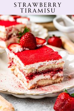 a piece of cake on a plate with strawberries