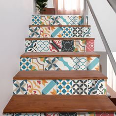 the stairs are decorated with colorful tiles and wood