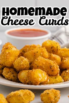 homemade cheese cubes on a white plate with dipping sauce in the background and text overlay