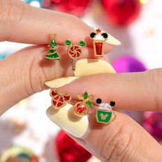 We've got your holiday sweet tooth covered with our Disney Mickey's Merry Munchies Earring Set! This festive set features four mismatched studs: a yummy lollipop, a mug of hot cocoa, an icy Frappuccino, and a classic candy cane – all adorned with Mickey's iconic silhouette and classic Christmas colors. Disney Princess Tangled, Disney Princess Sleeping Beauty, Disney Princess Mulan, Princess Tangled, Princess Sleeping Beauty, Disney Winter, Disney Princess Villains, Disney Princess Pocahontas, Princess Pocahontas