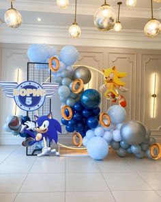 sonic the hedgehog balloon arch and balloons in a room with white tile flooring