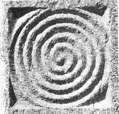 a black and white photo of a spiral design