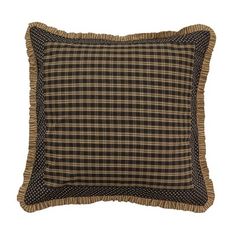 a black and brown plaid pillow with ruffle trim on the bottom, sitting on a white background