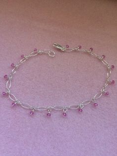 Pink mystic Quartz faceted rondelle beads dangle from sterling silver chain to create this dainty, feminine anklet. Sterling silver lobster claw clasp.  9" long. 1 1/4" extender chain can be added. Pink Jewels, Mystic Quartz, Silver Anklet, Jewelry Aesthetic, Sterling Silver Anklet, Bead Ideas, Wire Necklace, Silver Choker, Pretty Jewelry