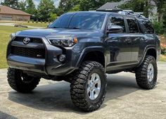 a gray toyota truck parked in a driveway