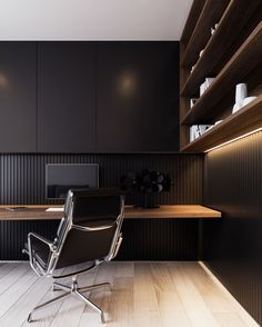 an office with black walls and wooden flooring is featured on the instagram page