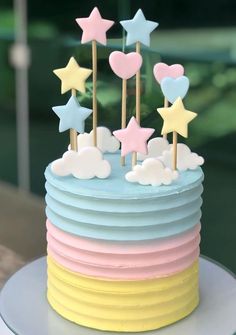 a cake with stars and clouds on top