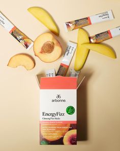 an open box of energifyzz next to some sliced peaches and apple slices