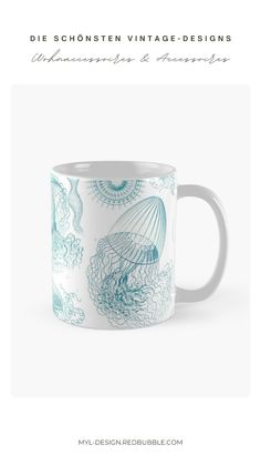 a blue and white coffee mug with an image of a jellyfish in the ocean