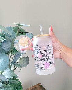 a hand holding a baby bottle with the label nurse reminders on it next to a potted plant