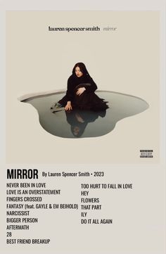 the poster for mirror shows a woman sitting on top of a table