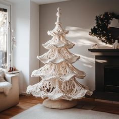 a white christmas tree sitting in the middle of a living room