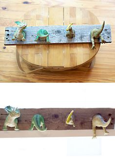 the dinosaurs are lined up on the wooden planks to look like they're playing with each other