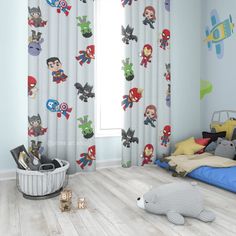 a child's bedroom with captain america wallpaper and superhero themed curtains, along with toys on the floor