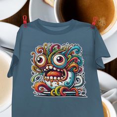 Confront the Over-Caffeinated Monster. It buzzes with jittery energy, and every twitch pulls you into an endless loop of restless chaos. Because every little freak deserves a shirt that shows their true form.  Printed on a Gildan 5000 heavy cotton tee, the basic staple of any human wardrobe.  The Gildan 5000 tee is a classic, heavy cotton tee that's built to last. Made from 100% preshrunk cotton, this shirt offers a soft feel with the durability you need. Each design is printed and centered on t Novelty Relaxed Fit Crew Neck T-shirt, Relaxed Fit Short Sleeve T-shirt With Mushroom Design, Cotton T-shirt With Mushroom Print, Crew Neck, Monster Shirt, Monster Tshirt, Kids Holiday, Holidays With Kids, Heavy Cotton, Cotton Tee