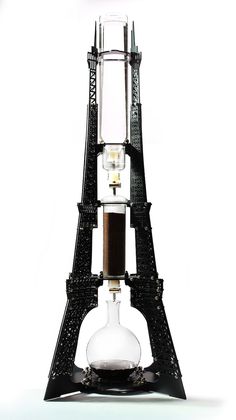 the eiffel tower is made out of glass and metal parts, with a light bulb