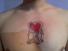 a man with a heart tattoo on his chest