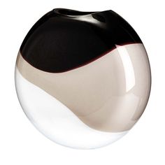 a black and white vase sitting on top of a table