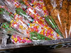 there are many different types of candy in the tray