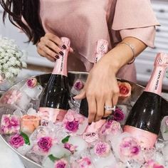 two pictures one is champagne and the other has flowers in ice with straws on them