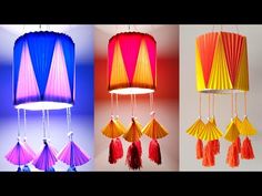 three different colored lamps hanging from the ceiling