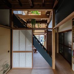 an empty room with stairs leading up to the second floor and another area in front of it