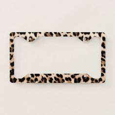 an animal print license plate frame on a white background