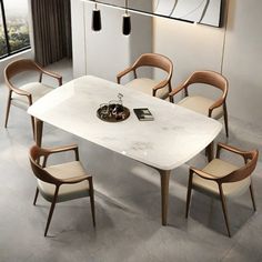 a white table and chairs in a room