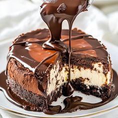 a piece of cake is being drizzled with chocolate on the top and bottom