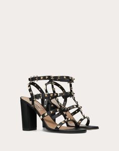 Valentino Garavani Rockstud sandal in calfskin leather. - Platinum-finish studs - Adjustable straps - Heel height 90 mm/3.5” - Made in Italy Luxury High Heel Sandals With Studded Outsoles, Luxury Studded Sandals For Party, Chic Ankle Strap Sandals With Studs, Luxury Studded Party Sandals, Summer Ankle Strap Heels With Studs, Chic Studded Open Heel Sandals, Evening Sandals With Studded Rubber Outsoles And Open Heel, Evening Sandals With Spikes And Round Toe, Designer Heels With Ankle Strap And Studded Outsoles