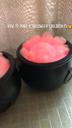 two black bowls filled with pink colored liquid