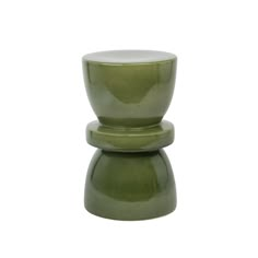 two green vases sitting on top of each other in front of a white background